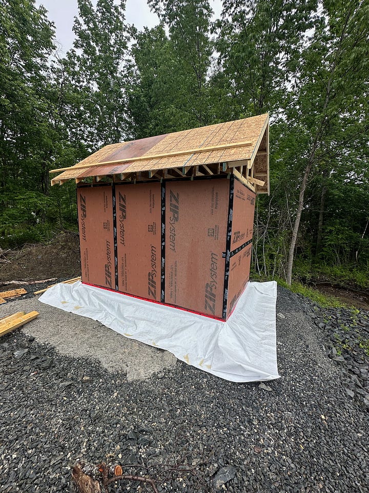 Tyvek housewrap skirt around the bottom edge of the walls.