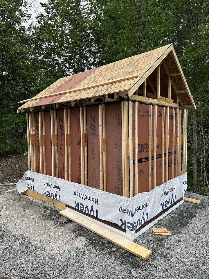 Larsen trusses being added to the outside of the walls
